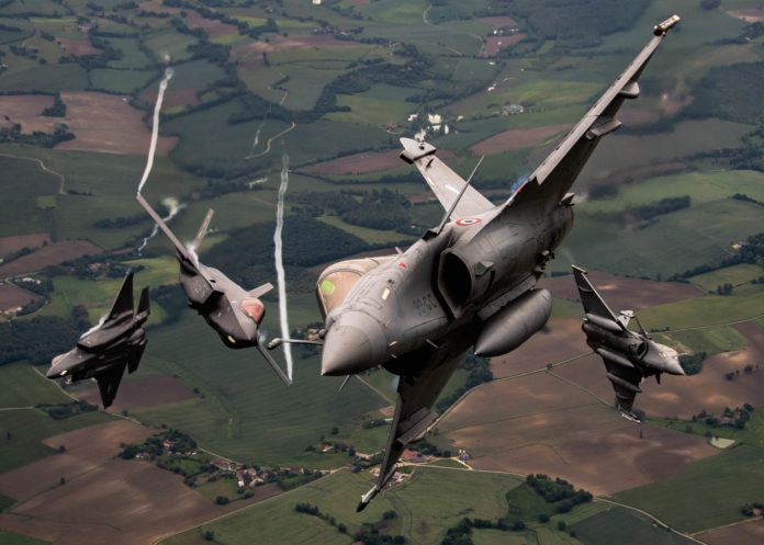 U.S. Air Force F-35As and French Rafales perform formation flight over France Rafale F-35A